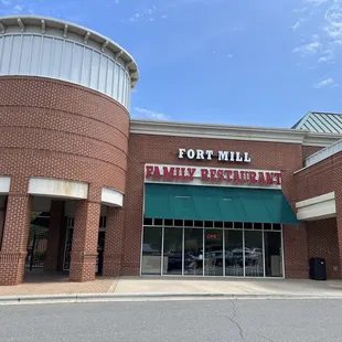 Outside building, front entrance.