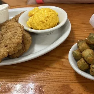 Chicken tenders , mashed potatoes, Mac and cheese, okra and bread rolls
