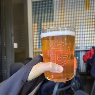 Kolsch and background wall of their beer cans~
