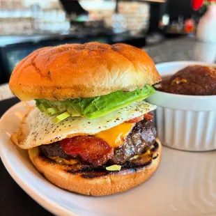 Brunch burger with bacon, avocado and fried egg