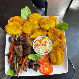 a plate of meat and vegetables