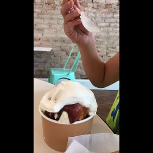 a person holding a donut