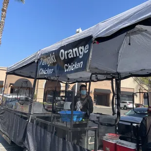 a man selling oranges