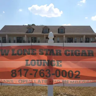 Our banner on the fence in front of our building.