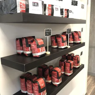 a shelf of coffee bags