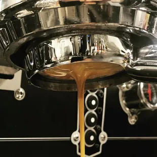coffee being poured into a coffee machine