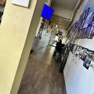 a long hallway with pictures on the wall