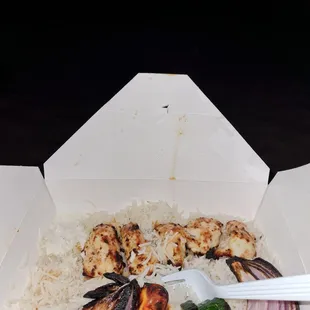 a box of food with a fork in it