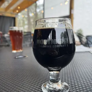 a glass of beer on a table