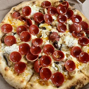 White pizza with pepperoni &amp; mushrooms added