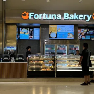 a woman standing in front of the counter