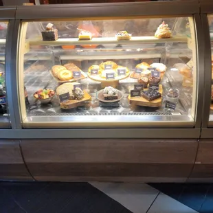 a display case of pastries in a bakery