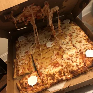 Their rendition of a well done Sicilian pizza. Raw dough included for free!