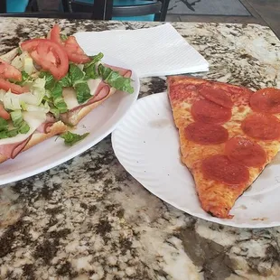 a slice of pizza and a salad