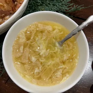 a bowl of soup and a bowl of rice