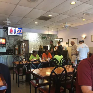 people eating at tables in a restaurant