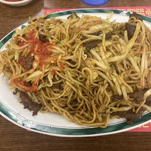 Beef chow mein with Sriracha, be real careful with the sriracha, the beef chow already comes a bit spicy.