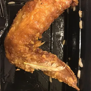 Chicken comes with a side of feathers. Yuck!
