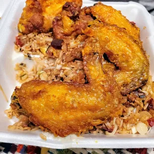 Fried chicken wings with fried rice.