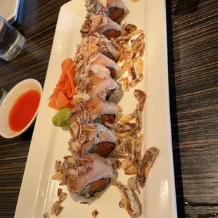 a plate of sushi rolls on a table
