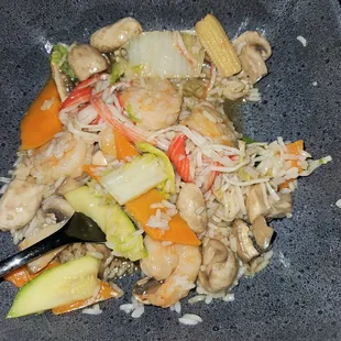 a plate of food with rice and vegetables