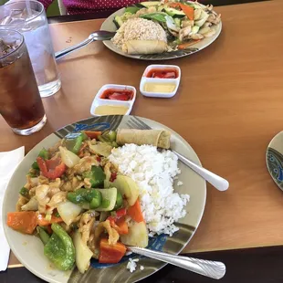 Mugu guy pan on the far side and chicken curry on the near side.