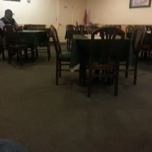 a man sitting at a table in a restaurant