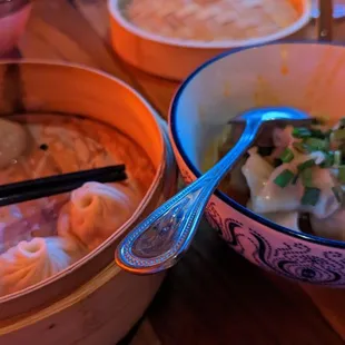 Pork soup dumplings and wontons in &apos;chili oil&apos;