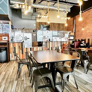 a dining area with tables and chairs