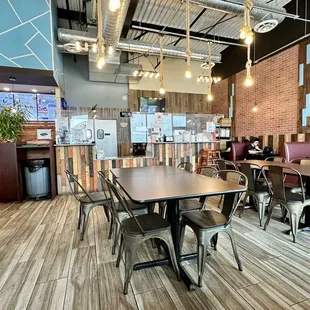 a dining area with tables and chairs