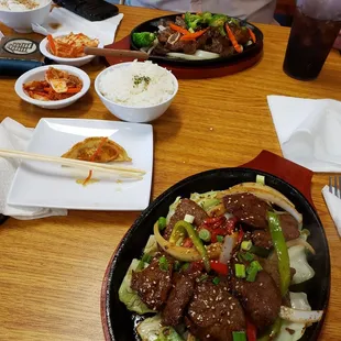 Fried dumplings as an appetizer, Korean marinated beef with sticky white rice and a side of kimchi.