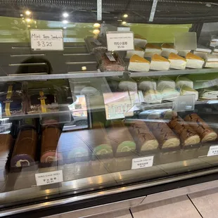 a variety of pastries in a display case