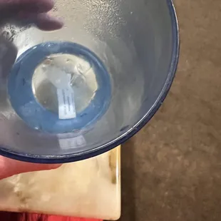 a person holding a glass of water