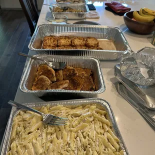 Chicken Alfredo catering with garlic bread, stuffed mushrooms and zucchini and squash
