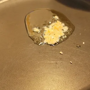 The start of "fixing" my food from this restaurant in my skillet at home. Garlic then seasoning.