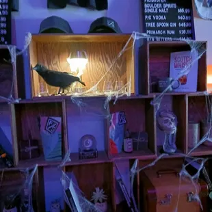 a room with a shelf full of halloween decorations