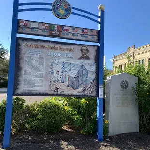 a sign in front of a building