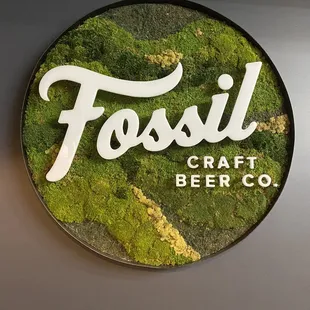 a moss covered sign