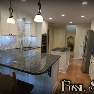 a kitchen with granite countertops