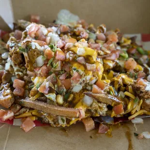 Loaded jerk chicken fries from Foster&apos;s Cafe and Catering