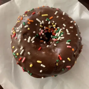 a chocolate donut with sprinkles