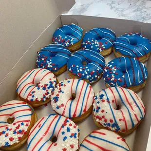 a box of decorated donuts