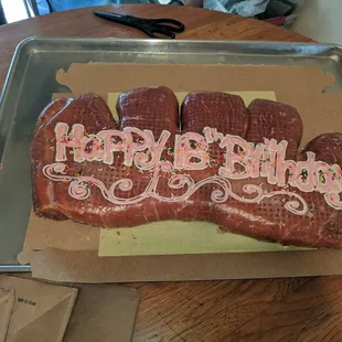 the words happy birthday on a piece of meat