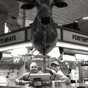 two men behind a counter
