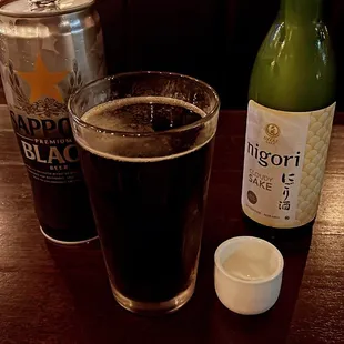 a plate of donuts and a glass of beer