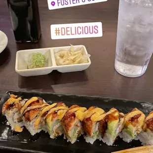 a plate of sushi and a glass of water