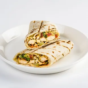 chicken shawarma pita: 
with hummus, roasted eggplant dip, pickled cucumbers, Israeli salad, tzatziki w/ lemon tahini &amp; hot sauce