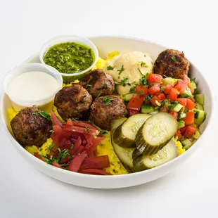 Beef and lamb meatballs, hummus, garlic whip, pickled onions, Israeli salad, pickled cucumbers, skhug and saffron basmati rice