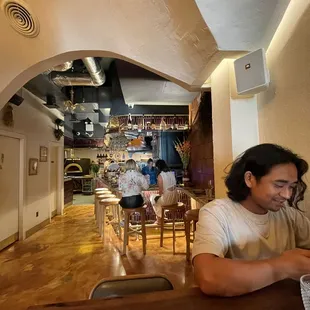 a man sitting at a table in a restaurant