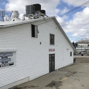 a white building with a sign on the roof